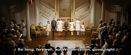 A group of seven children bow while singing "so long, farewell, auf Wiedersehen, good night"