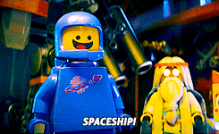 A Lego astronaut figure joyfully shouts "SPACESHIP" and runs away