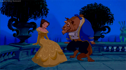 Beauty looks lovingly at Beast as he looks nervous