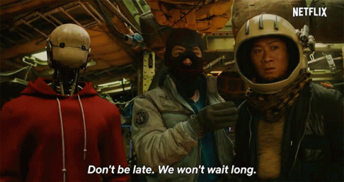 The cast of Space Sweepers (including the robot) looks on as someone says "Don't be late. We won't wait long."