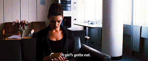 Anne Hathaway as Catwoman says, "A girl's gotta eat."