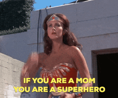 Wonder Woman deflecting sparks with her bracers with the text "If you are a mom you are a superhero"