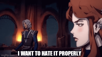 An animated woman with pointed ears, long chestnut hair, pale skin, and sharp canines says "I want to hate it properly."