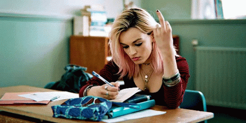 Emma Mackey as Maeve Wiley of Sex Education flips off the camera