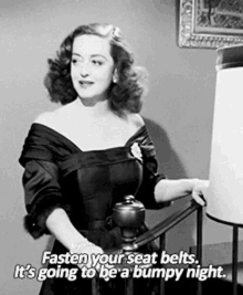 In black and white, Bette Davis says, Fasten your seatbelts, it's going to be a bumpy night.